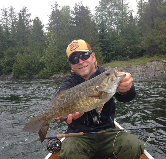 Dan Munger with another big smallmouth bass caught on a fly.